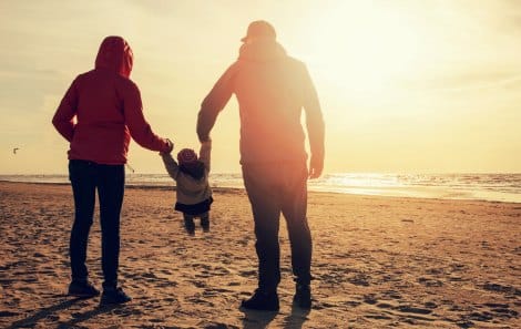 Family of three on a beach
