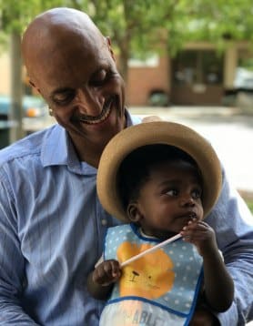 Lifetime adoptive dad Aaron admires his son