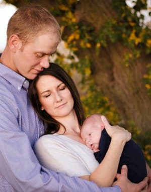 Ross and Carol with their son when he was an infant
