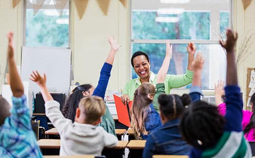 teacher reading to school children