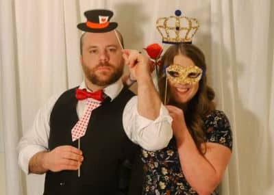 Jesse and Cassie having fun with photo booth props at a recent youth group event