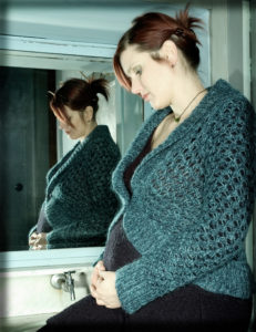 pregnant woman looking sad
