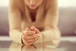 woman worried and praying