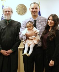 The judge, Jesse, Alicia, and their daughter at the adoption finalization!