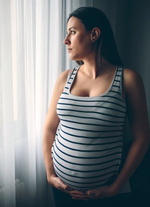 Pregnant woman thinking about her pregnancy choices