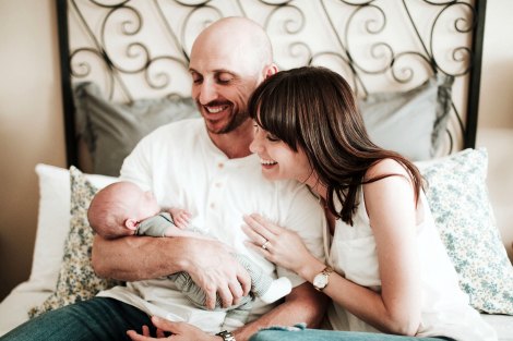 Happy adoptive couple following tips on how to bond with your baby after adoption