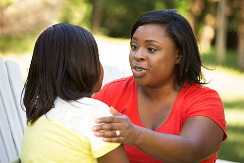 Mother scolding her teen daughter, who wonders can my parents make me get an abortion
