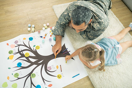 Parent and child drawing a family tree