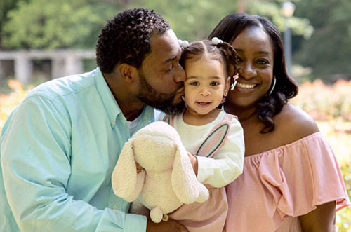 Lifetime adoptive parents Jamaal and Erin with their daughter