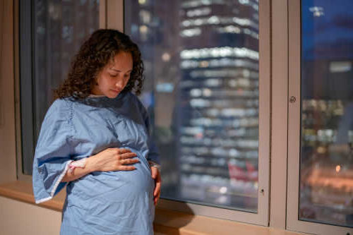 Expectant mother in the early stages of labor at the hospital