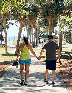 Hopeful adoptive parents Katie and Steve walking hand-in-hand